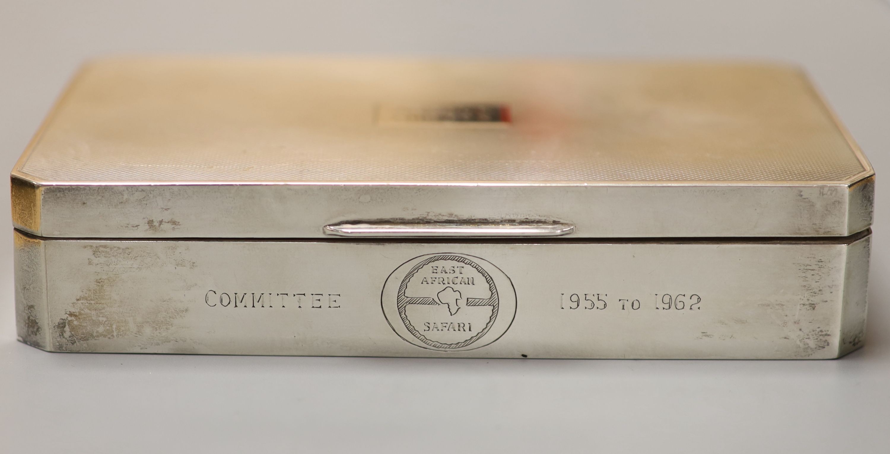 Three silver mounted cigarette cases, largest 17.9cm.
